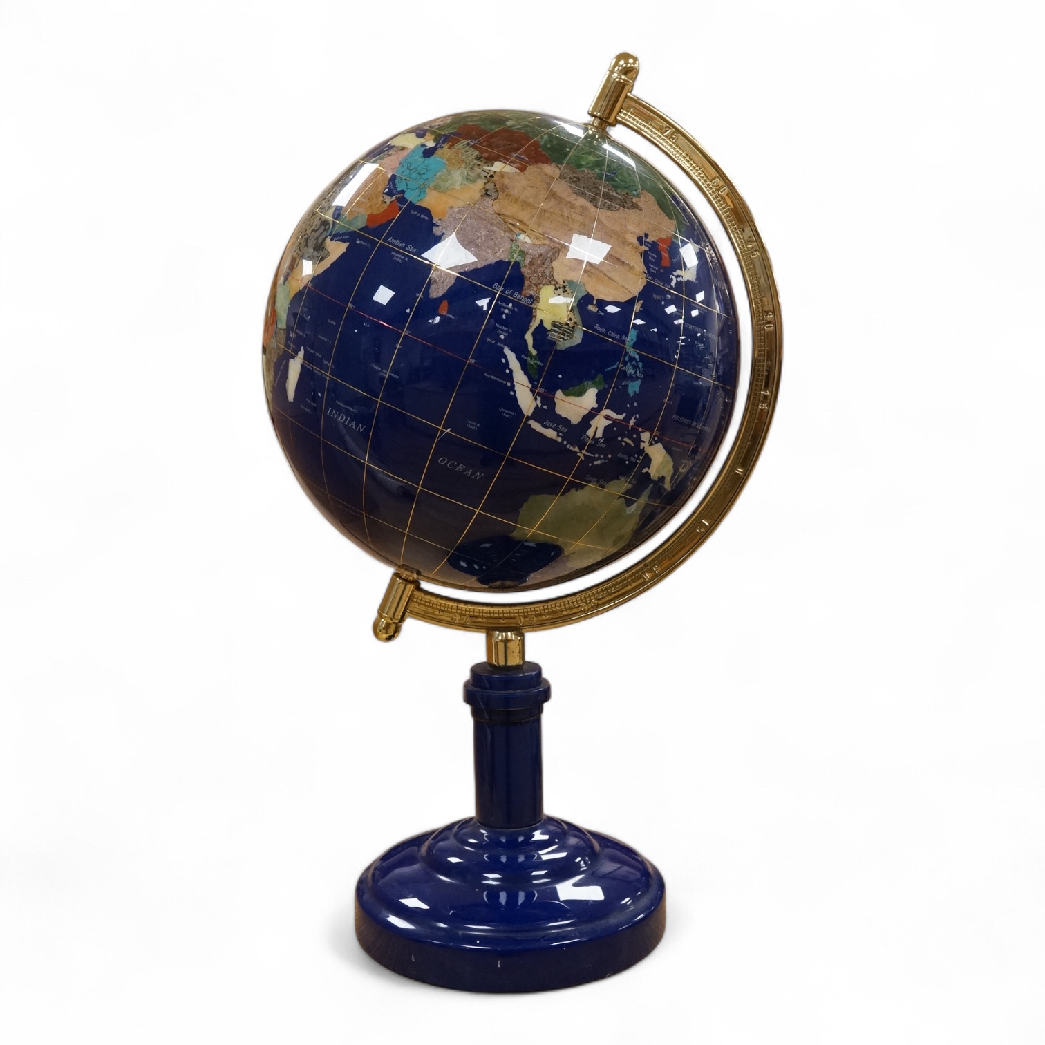 A large table top hardstone overlaid globe, 62cm high